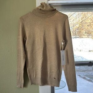 Golden sparkly light sweater by Calvin Klein.
